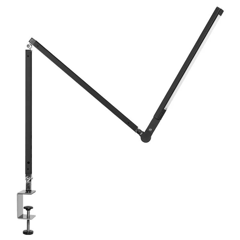 Black clip mount LED desk lamp with dimmer switch attached to study desk edge