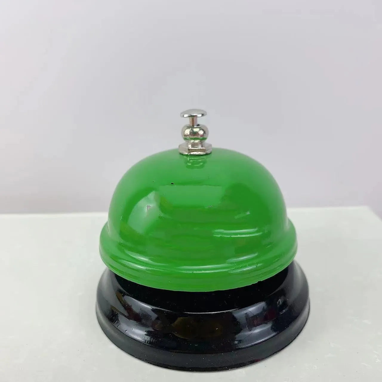 Iron game bell shown in one of ten available colours: blue, green, pink, red, yellow, green tea, or rose kiss.