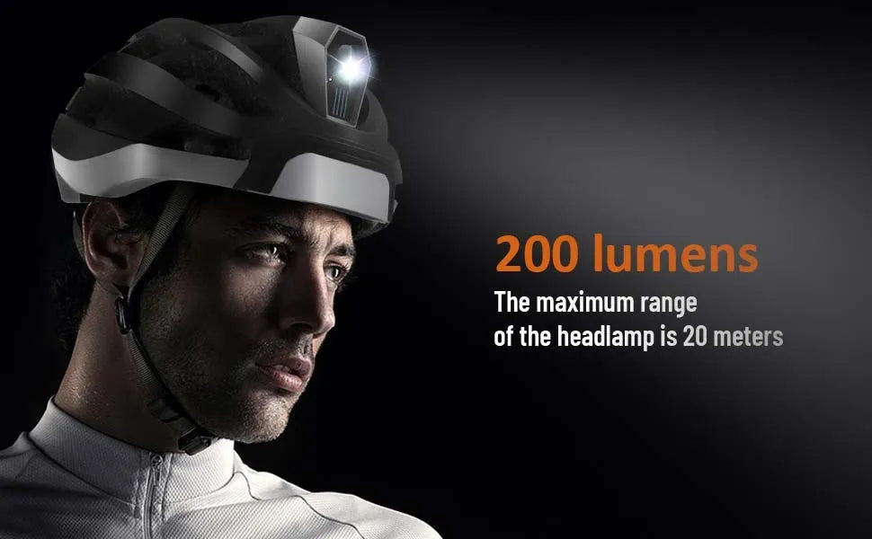 Black and grey smart riding helmet with integrated warning light on the rear, showing USB charging port.