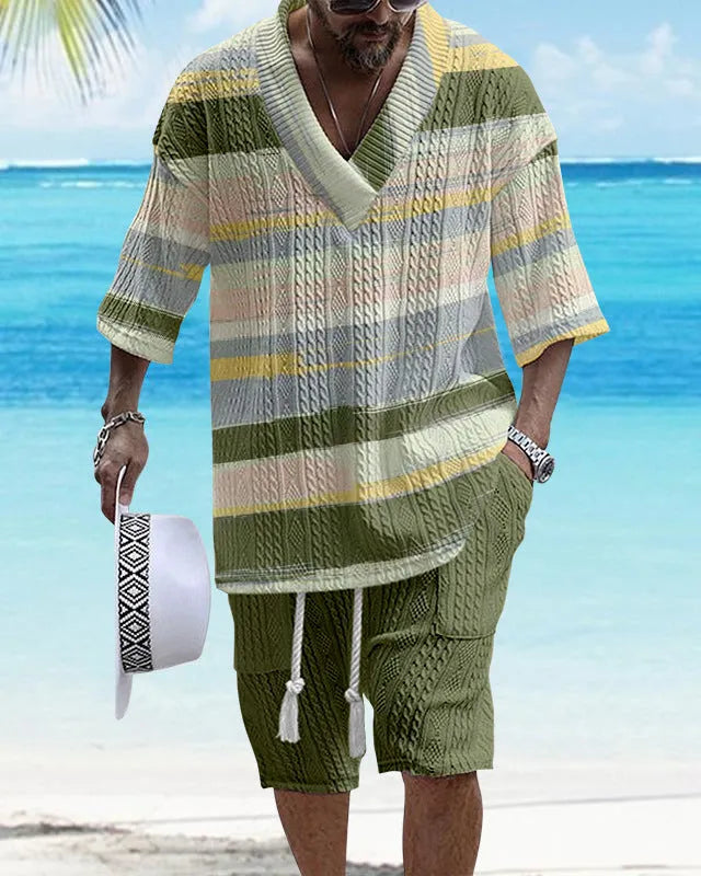 Man wearing a loose-fitting casual short sleeve suit with matching shorts in a solid colour.