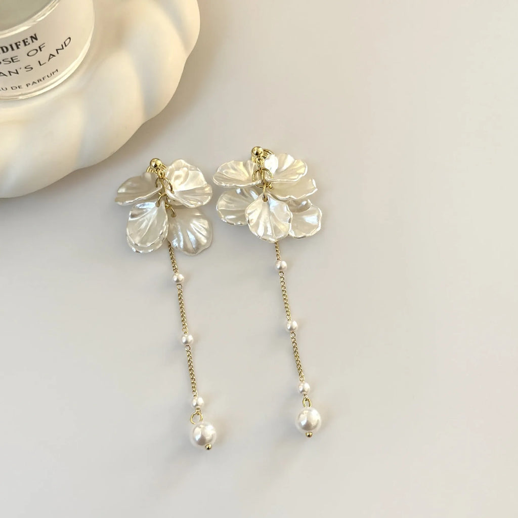 Women's silver shell pearl tassel earrings showing 8.8cm length and clip options