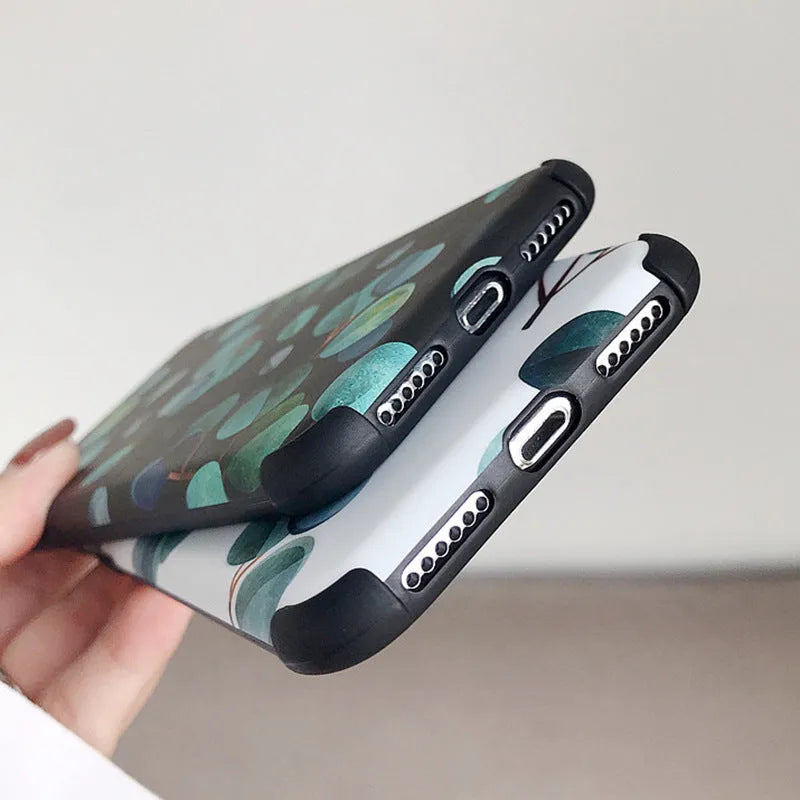 Black silicone iPhone case with leaf pattern design showing front and back views