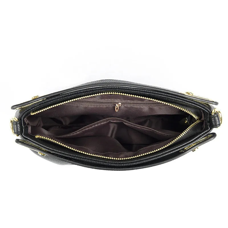 Genuine leather crossbody bag with pleated shoulder strap, horizontal square shape, available in six colours including black, khaki, green, beige, blue, red