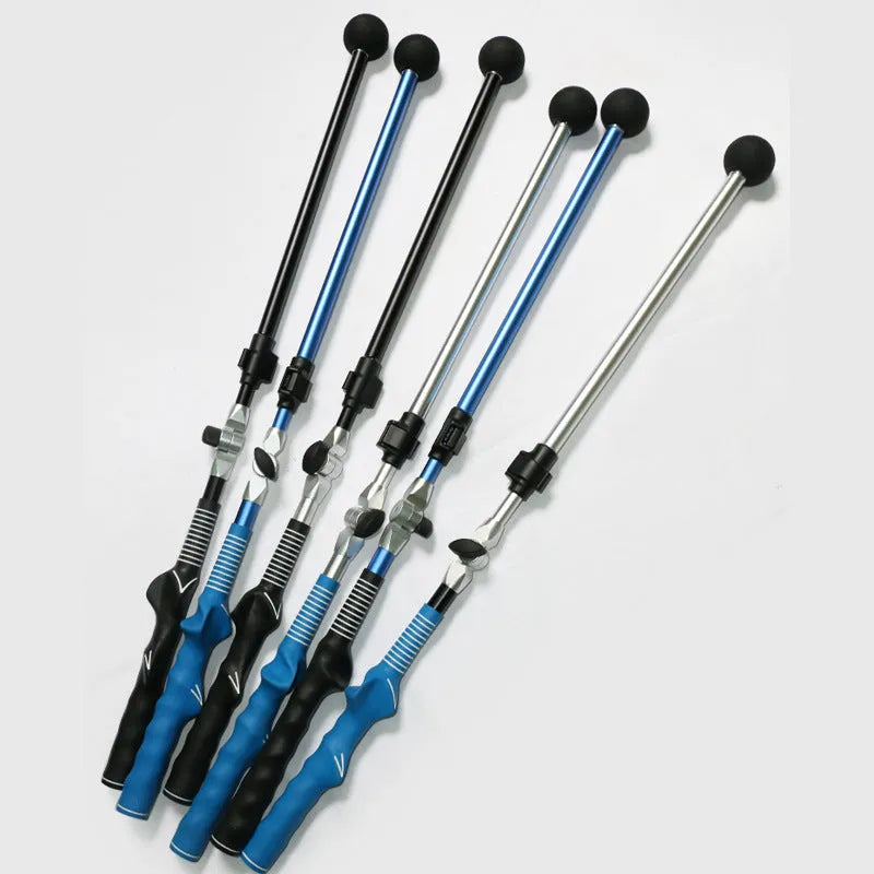 Golf folding swing trainer with black aluminium shaft and rubber grip on grass