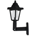 Black hexagonal solar-powered wall lamp with light sensor for outdoor use