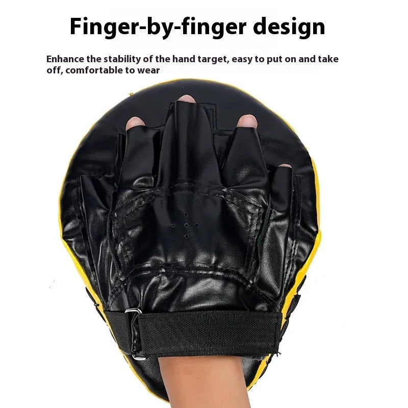 Curved red and black PU boxing punch mitts held vertically for martial arts training.