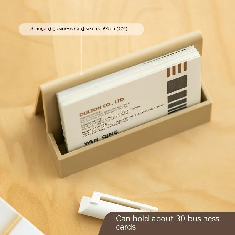 Geometric PS plastic business card stand with 20 slots in brown on a desk