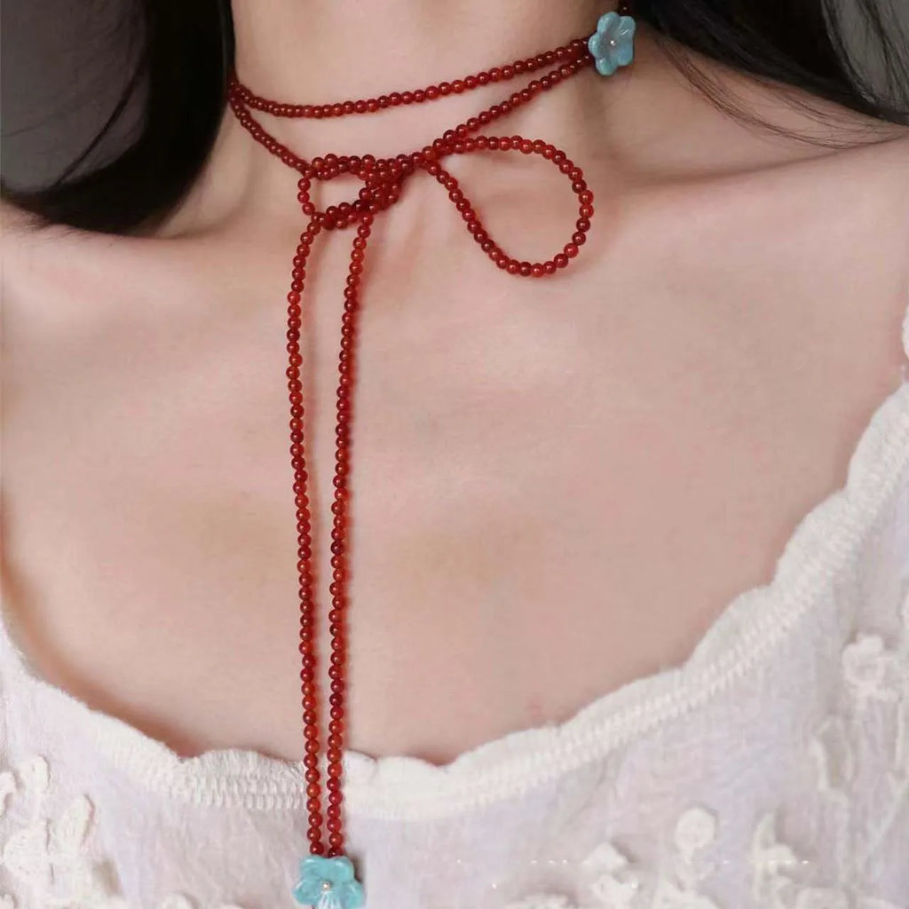 Red agate and acrylic geometric beaded necklace on a woman, adjustable chain 31-40cm