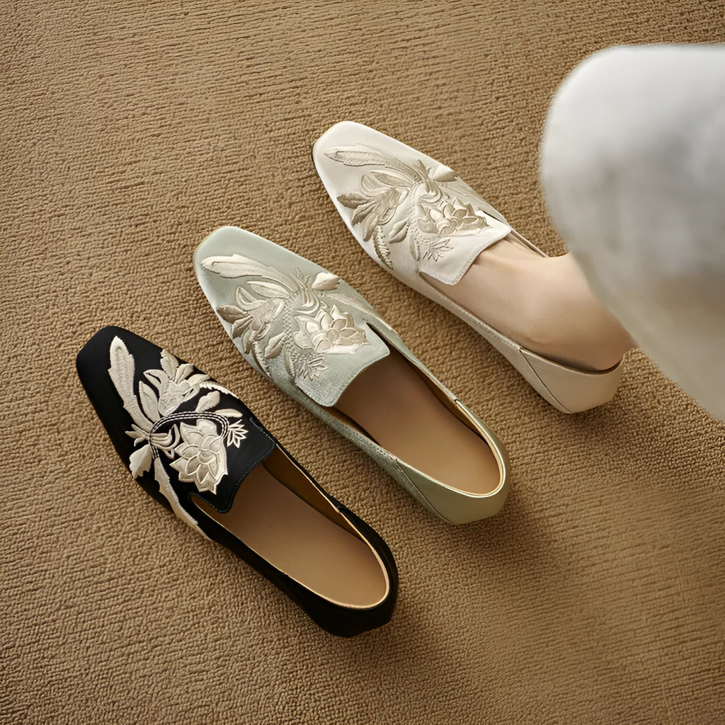 Women's beige retro flat pumps with embroidery detail, round toe, and a low-cut design on a soft bottom.