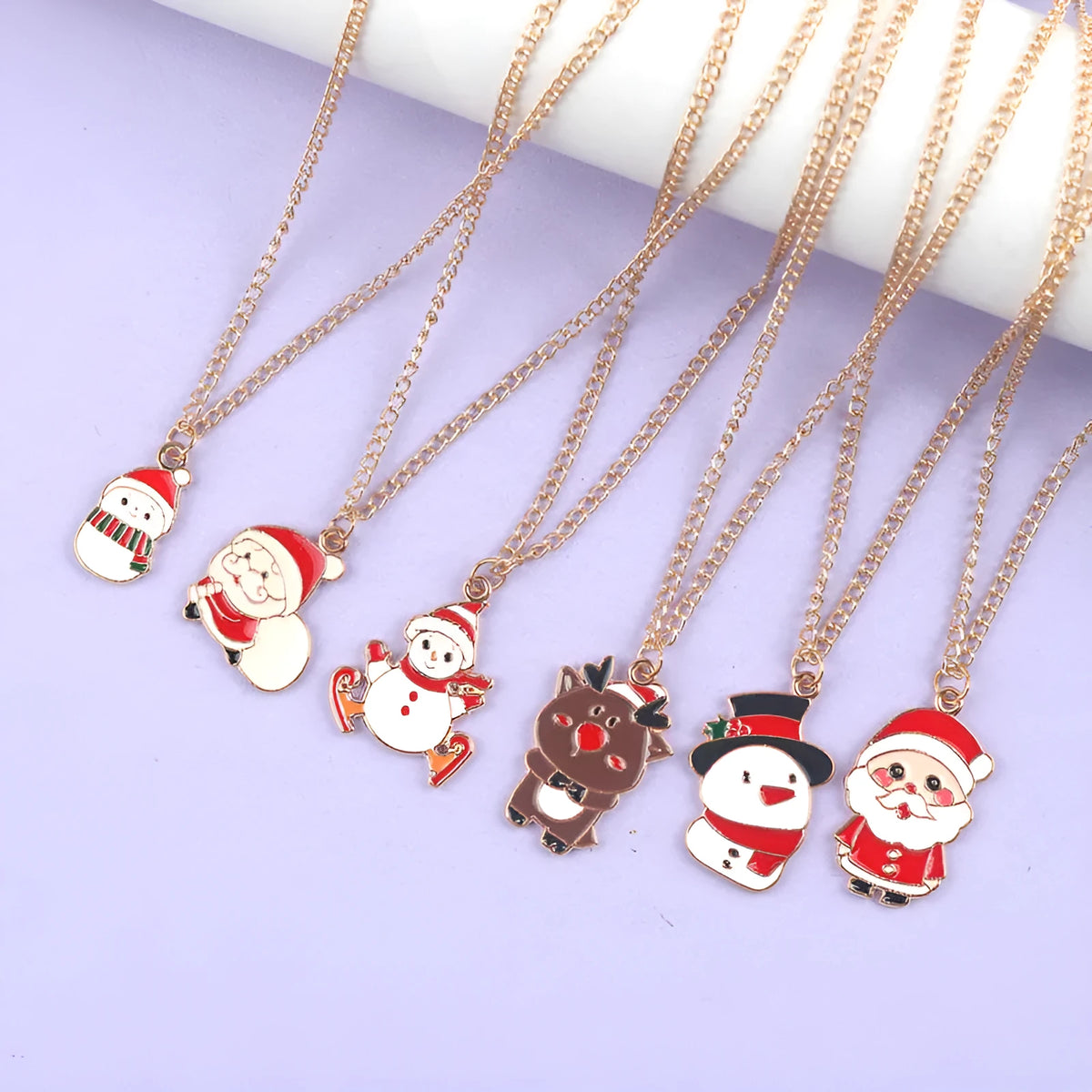 Christmas necklace with cartoon Santa Claus, snowman, or elk alloy pendant on a gold chain.