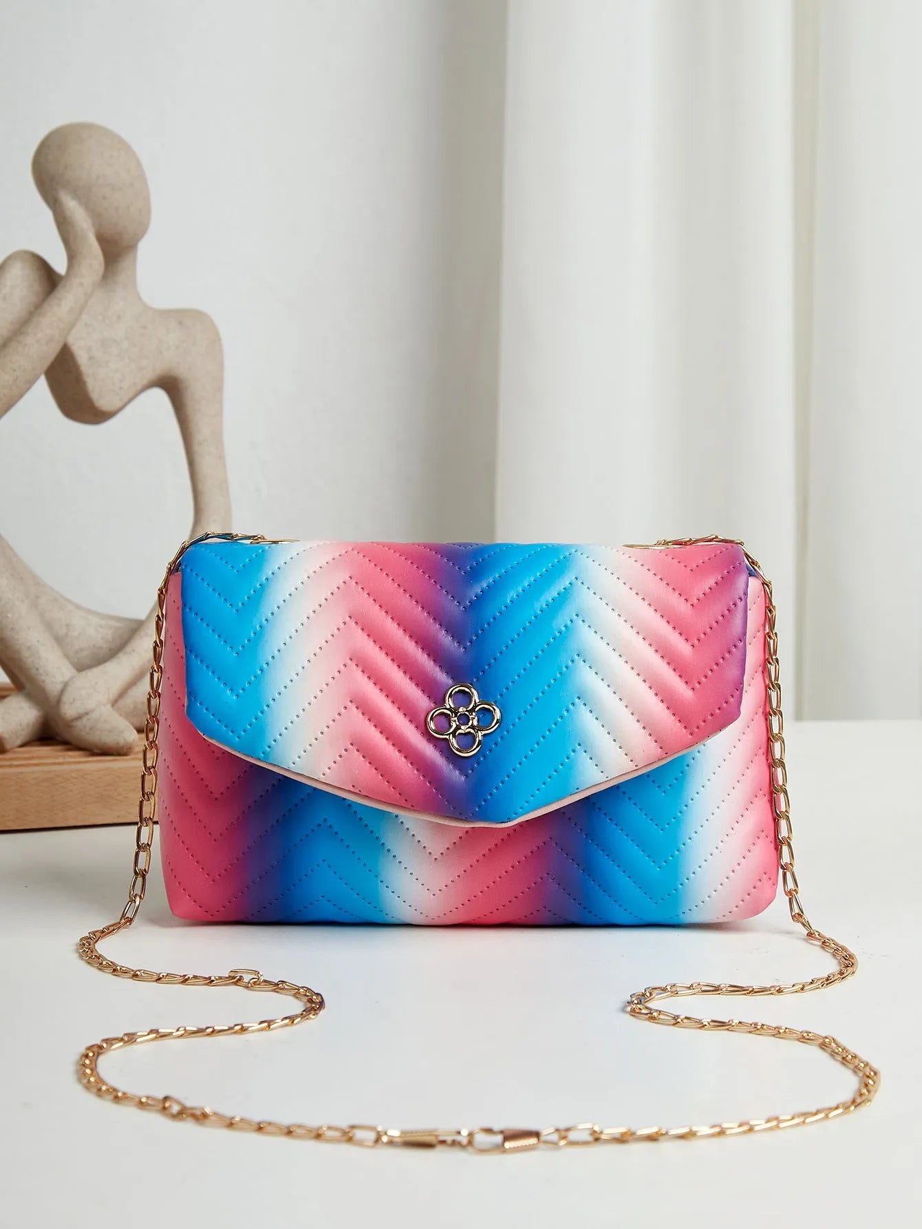 Soft PU clamshell bag with contrast colour pattern and single shoulder strap