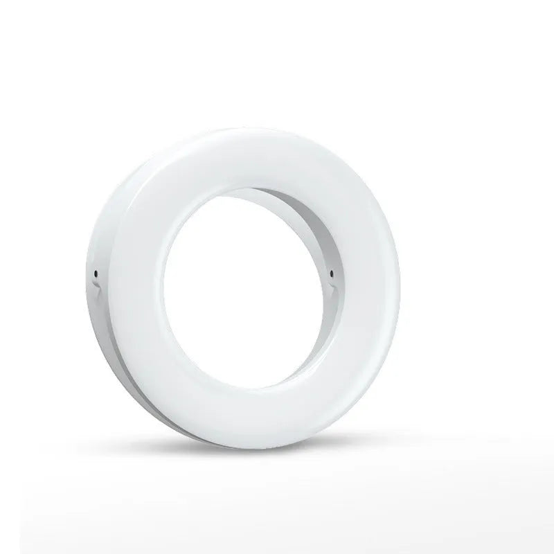 Compact black selfie ring light with USB cable for mobile phone photography and video lighting.