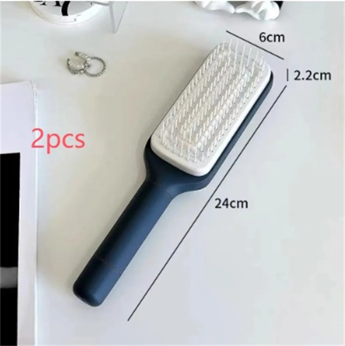 Roland purple self-cleaning hair brush with rotating handle and anti-static teeth