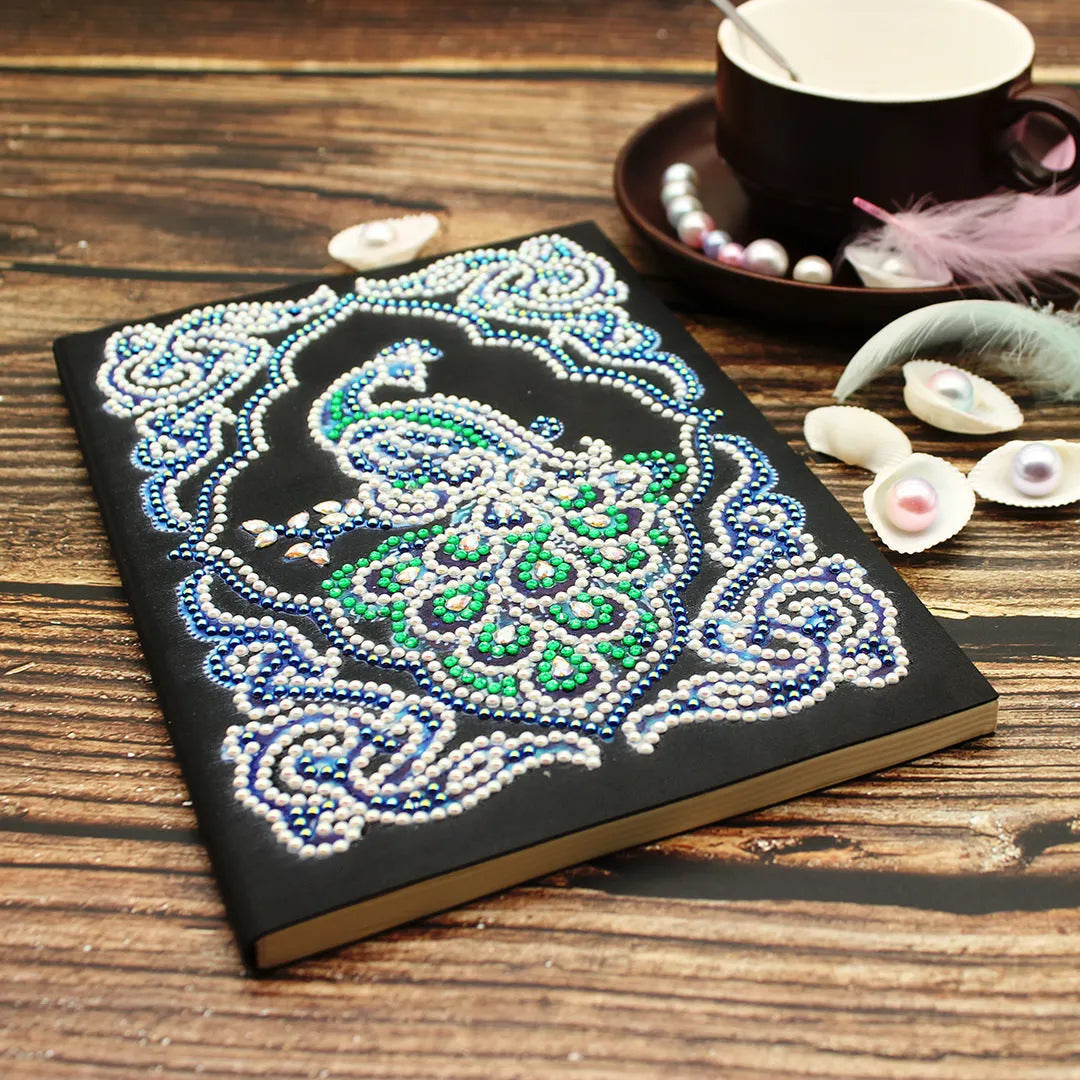 A5 diamond painting notebook with peacock design using shaped and bright drill crystals