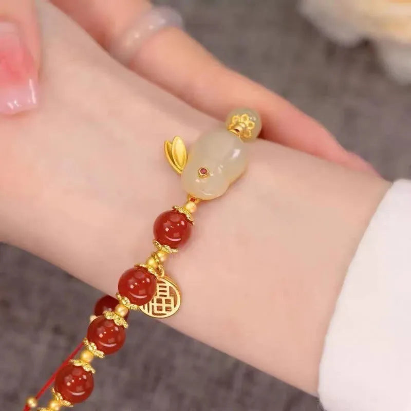 Chinese style glass bead bracelet with bamboo leaf design and manual craftsmanship details.