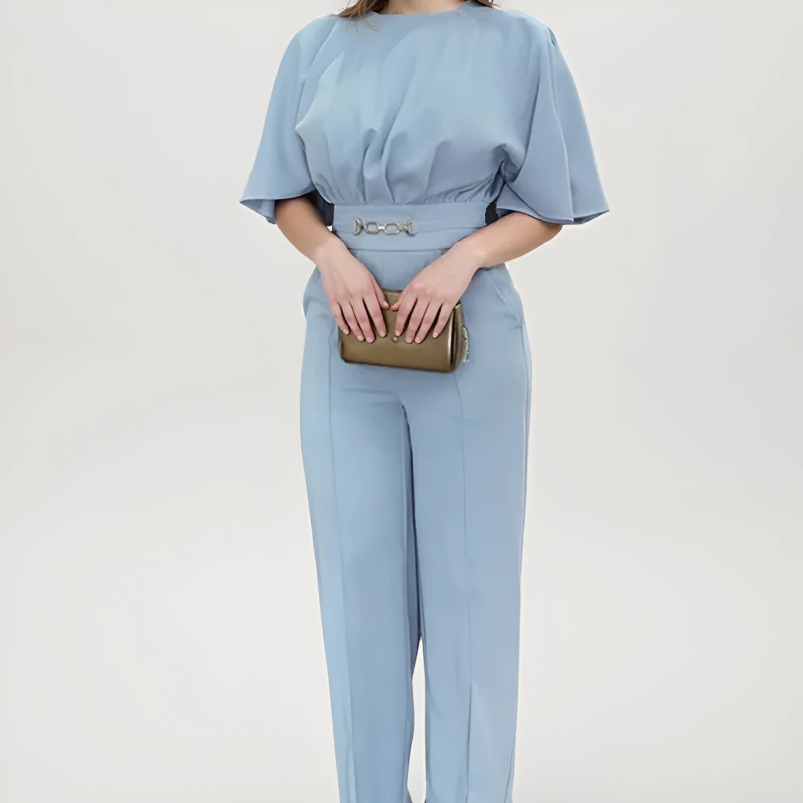 Blue men's two-piece polyester suit with long sleeves and trousers on a hanger