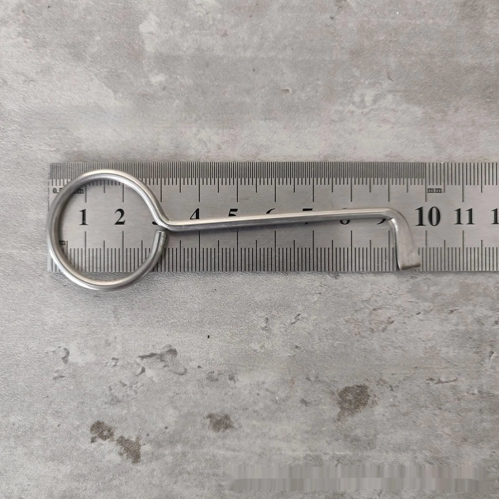Two silver alloy universal wrench tools side by side on a surface.