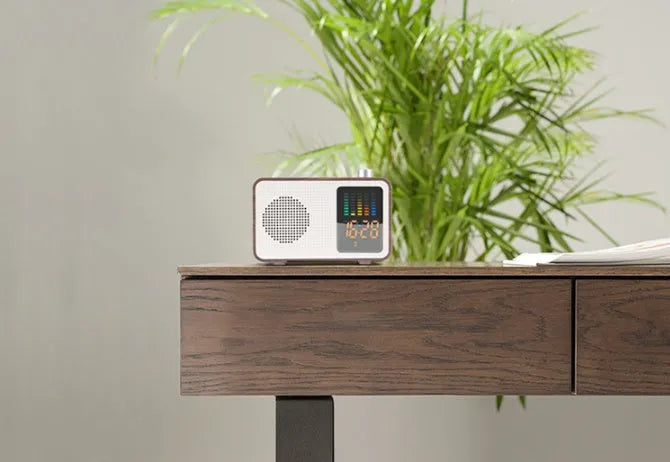 Brown retro Bluetooth speaker with woodgrain finish showing FM radio and connectivity ports