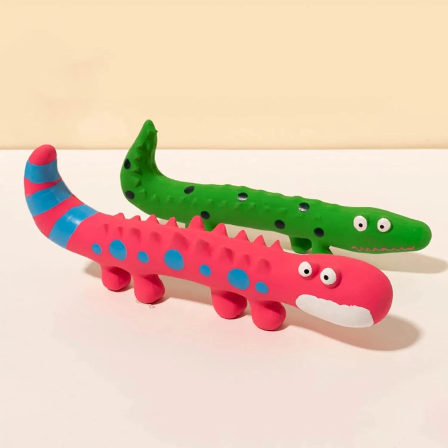 Green cartoon lizard-shaped latex dog squeaky chew toy for aggressive chewers.