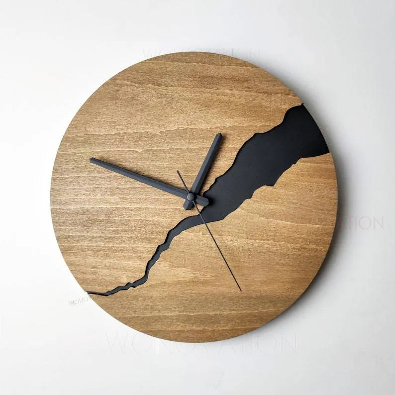 Modern wooden wall clock with a creative crack effect finish on its face, showing a silent second hand.