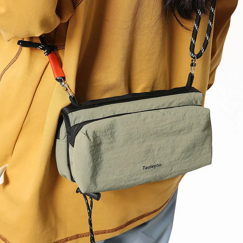 Women's sports crossbody bag nylon pillow shape 22cm length 4cm width 9cm height stitching black