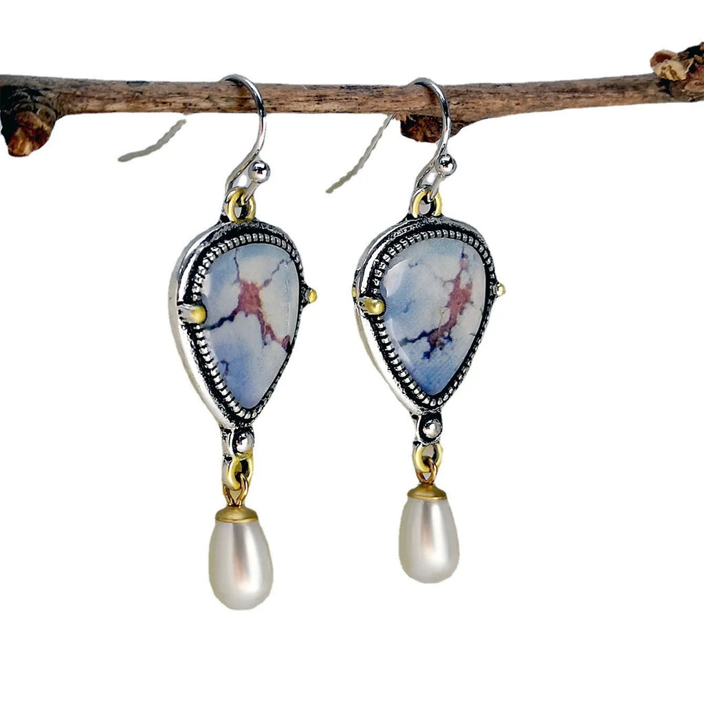 Retro blue Bohemian drop earrings with synthetic opal and pearl details on metal geometric setting