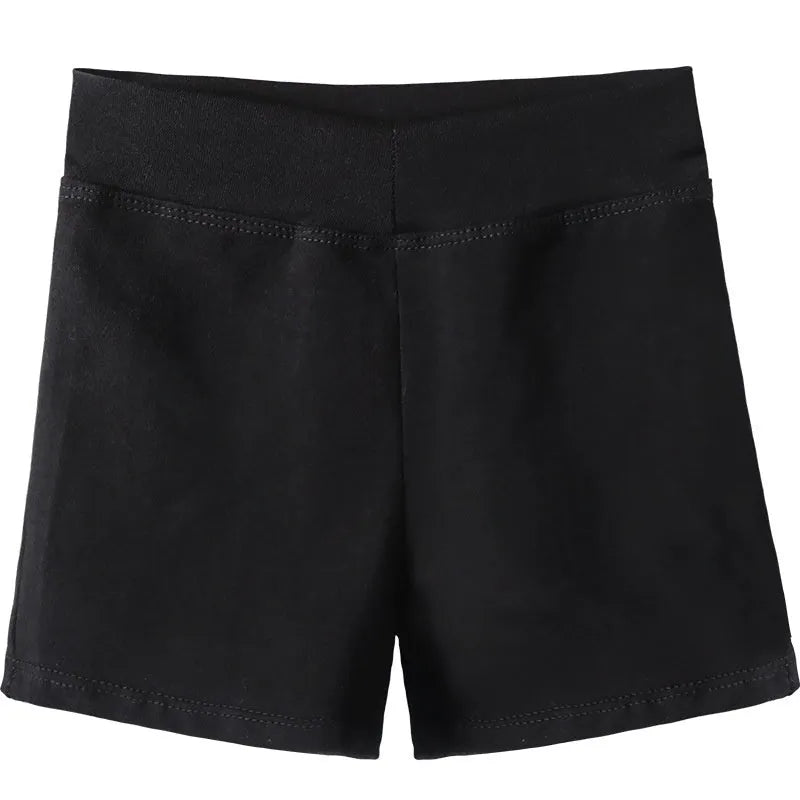 Black cotton women's ballet practice trousers laid flat, showing solid colour and fit for dance exercise.
