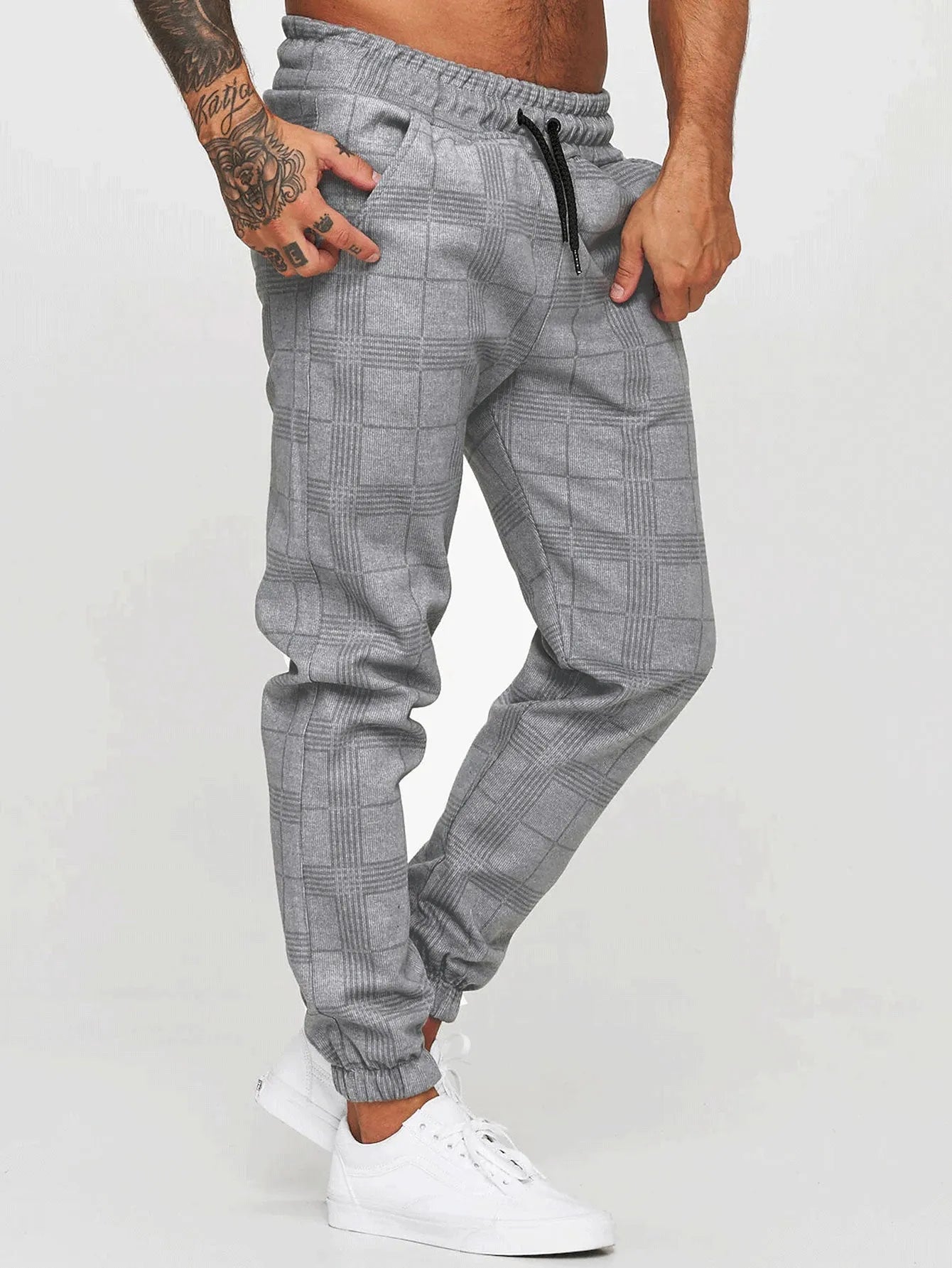 Cotton printed casual tapered trousers for men in black side view