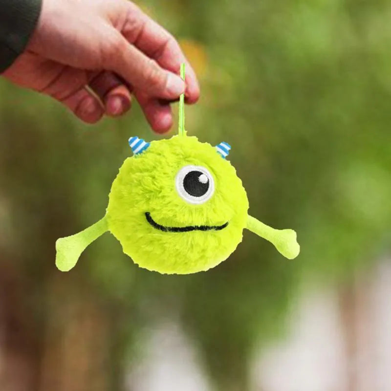 Green plush and TPR puppy teething ball with squeaker, 12 cm diameter