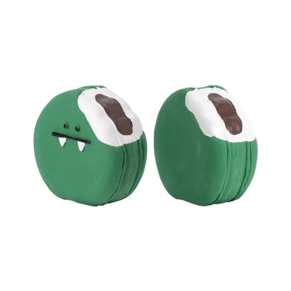 Yellow and green cartoon bread egg shaped latex squeaky toy for dogs on a white background.