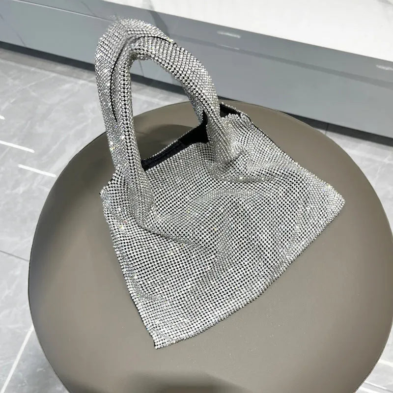 Silver rhinestone handbag with cotton thread body and open outer pocket for dinner and party use