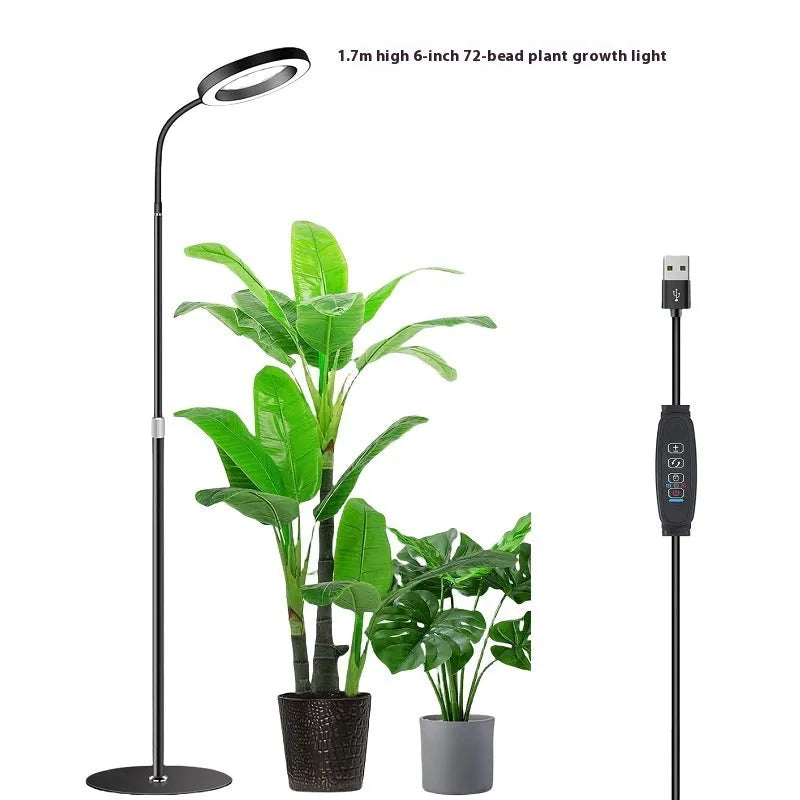 White aluminium alloy retractable floor stand plant grow light with angel ring head positioned over indoor plants.