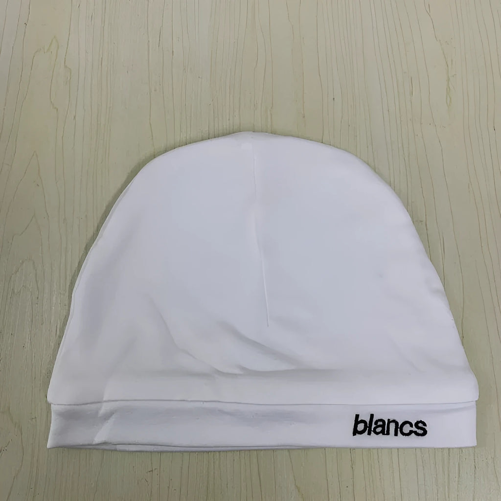 White polyester cap with embroidered letter detail, front view