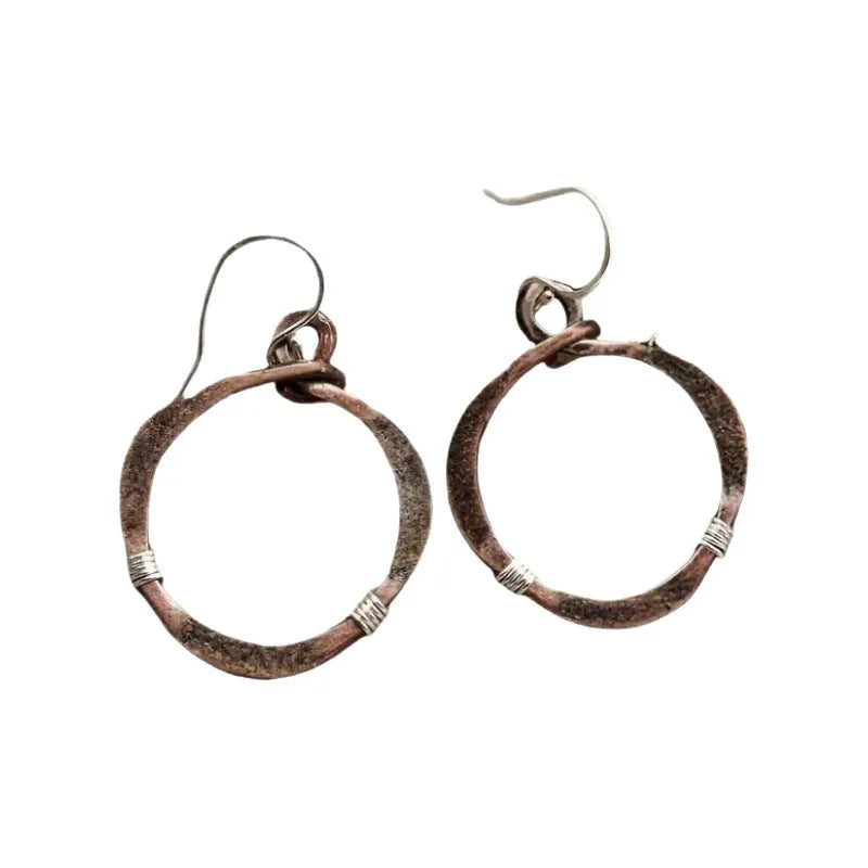 Bronze retro hollow round geometric bohemian earrings for women on light background