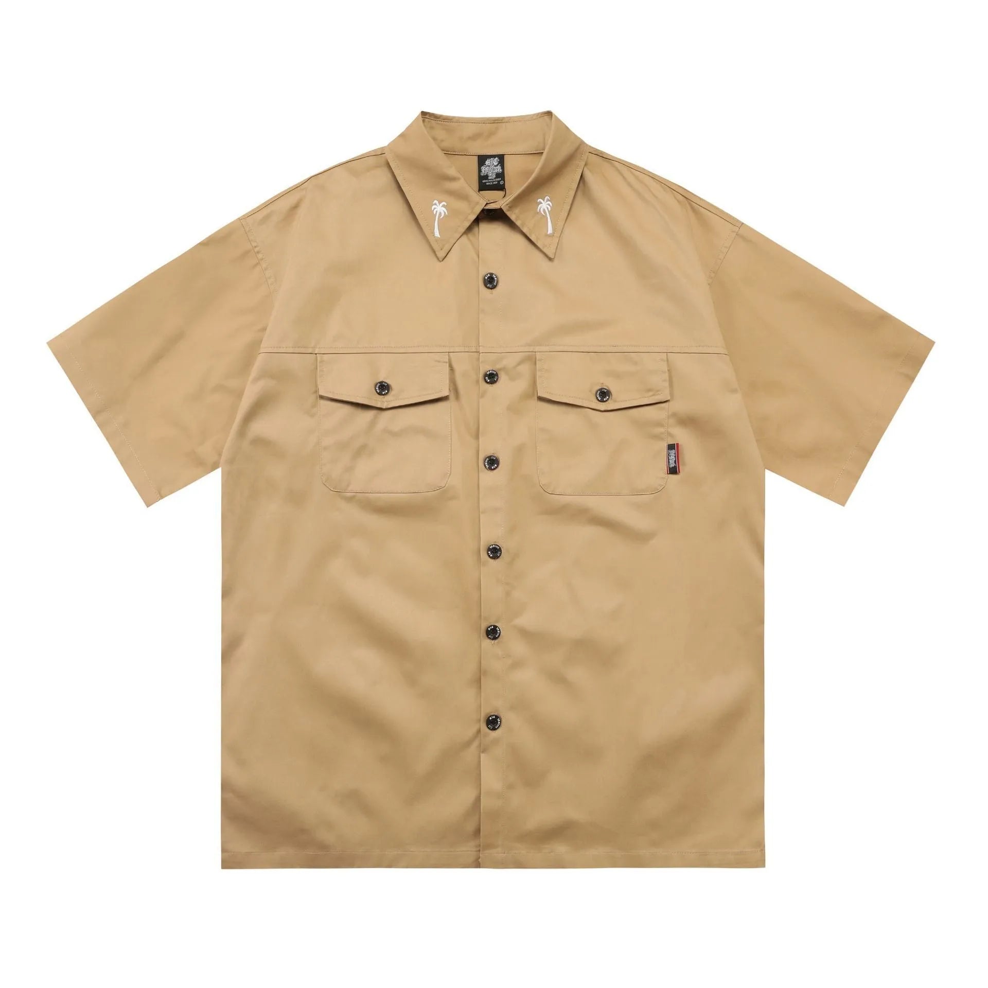 Man wearing a black loose-fit cotton blend embroidered pocket shirt with half-length sleeves.