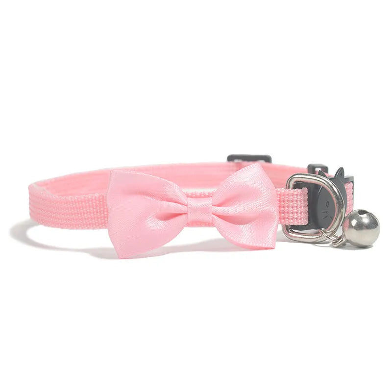Adjustable nylon cat bow collar with a bell in a striped pattern, shown in a bright colour.