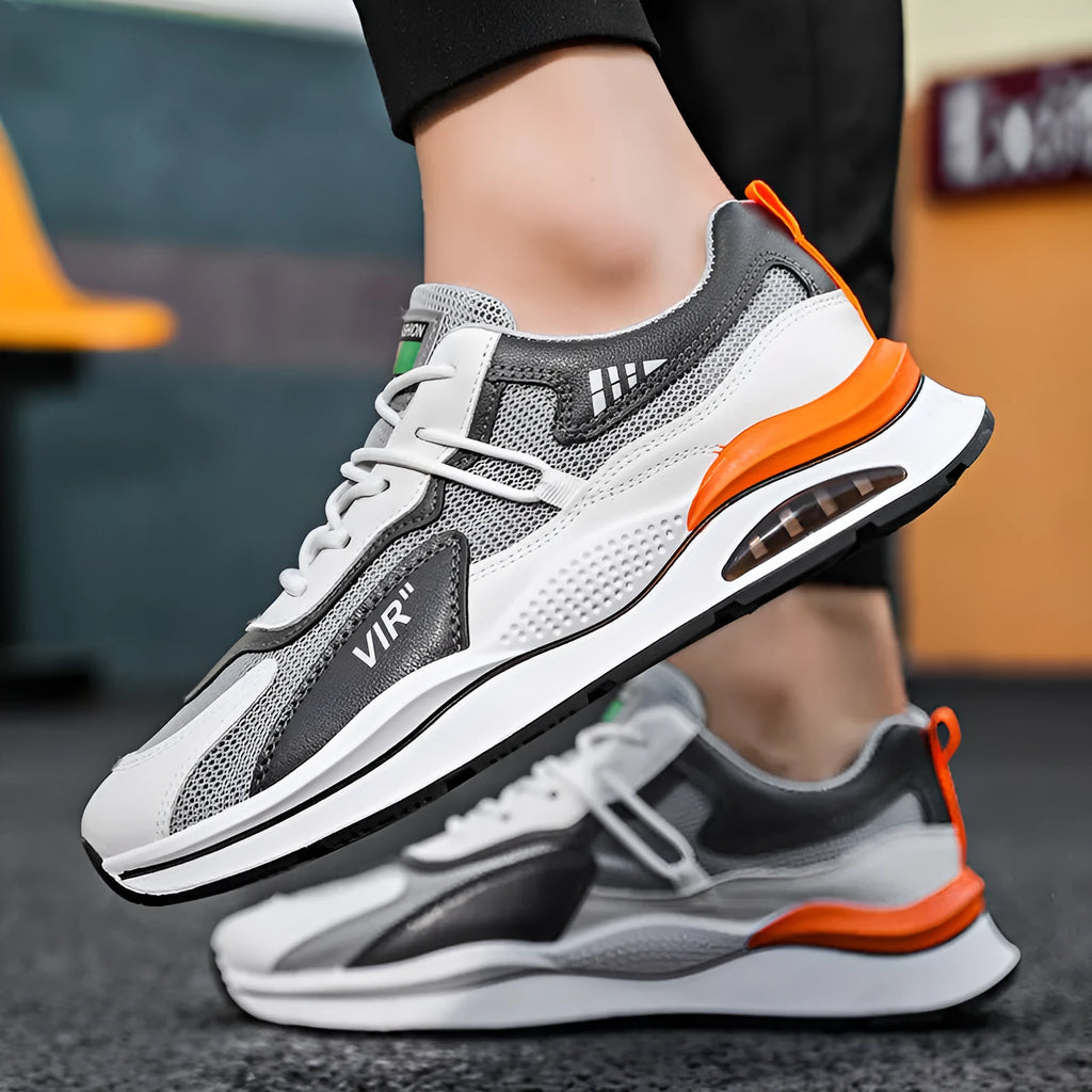 Men's grey mesh running shoes with round toe and middle top design on light background