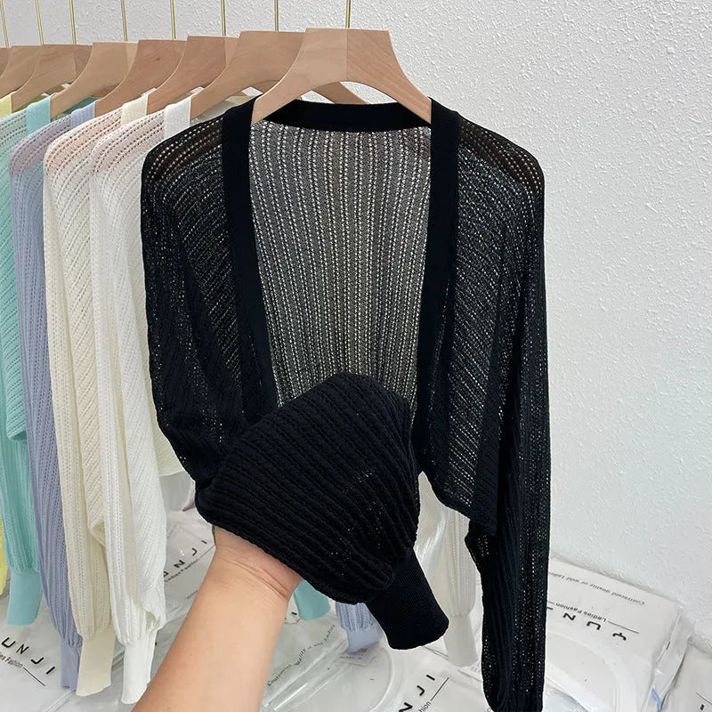 Women's hollow thin blouse with long lantern sleeves in linen-composition fabric, shown in apricot colour.