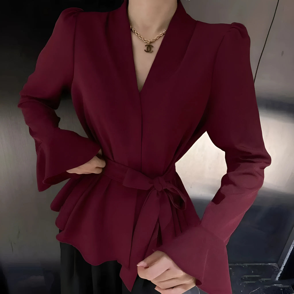 Women's black French-style shirt with irregular collar and long tied bell sleeves.