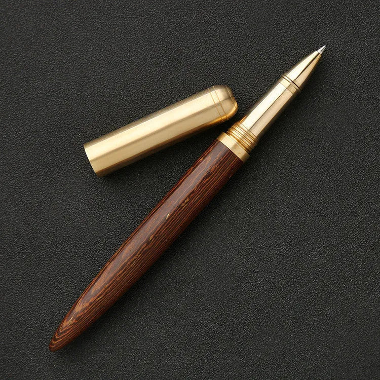 Brass sandalwood signature pen 14cm with wood barrel on a flat surface