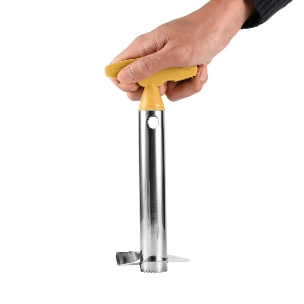 Stainless steel pineapple peeler with ergonomic handle and sawtooth blade on a countertop