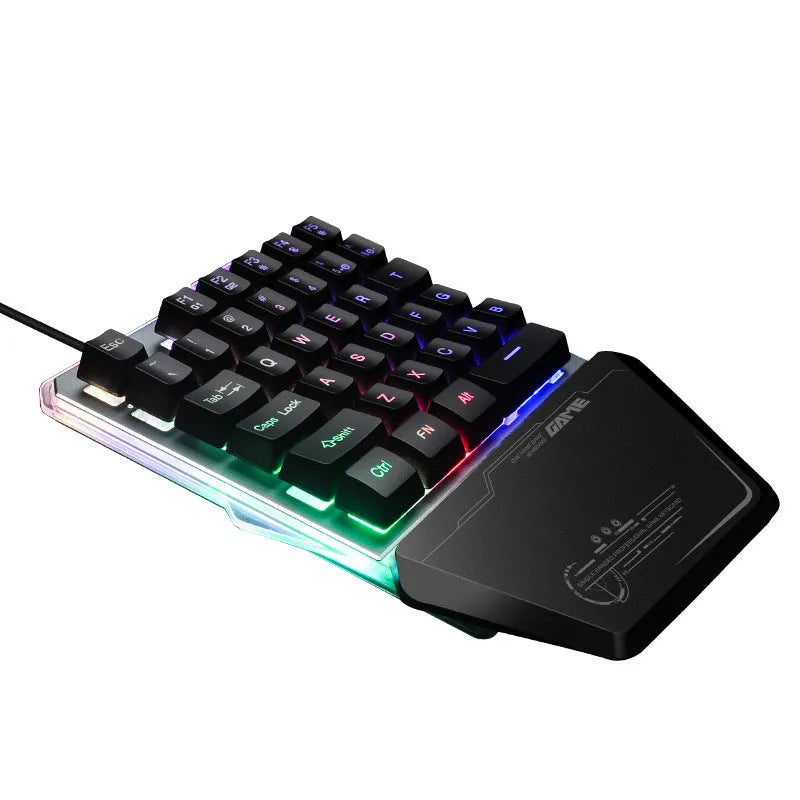 Black G40 Flow one-handed mechanical gaming keyboard with RGB backlit keys on a desk.