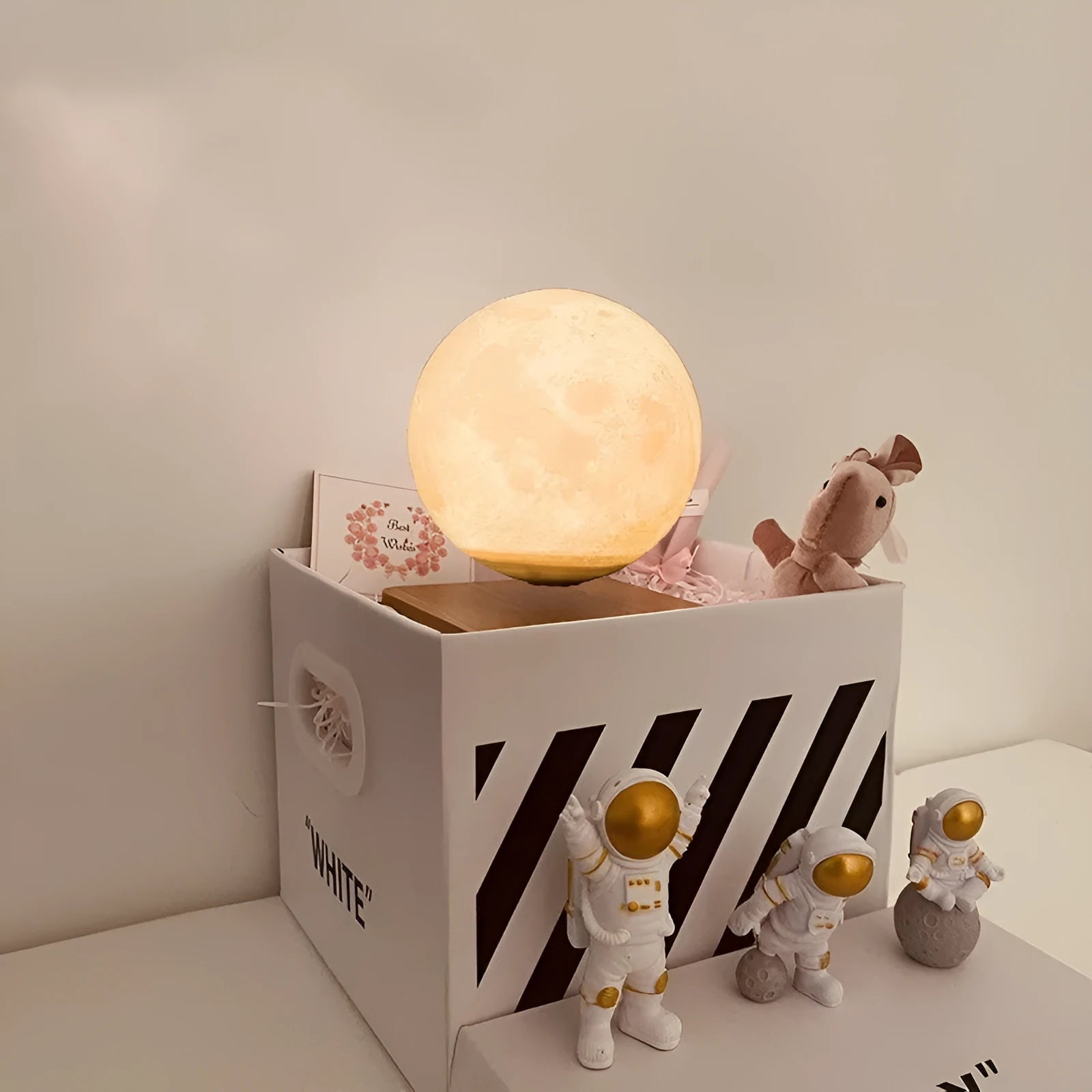 Maglev floating moon night light with LED illumination and astronaut figurines