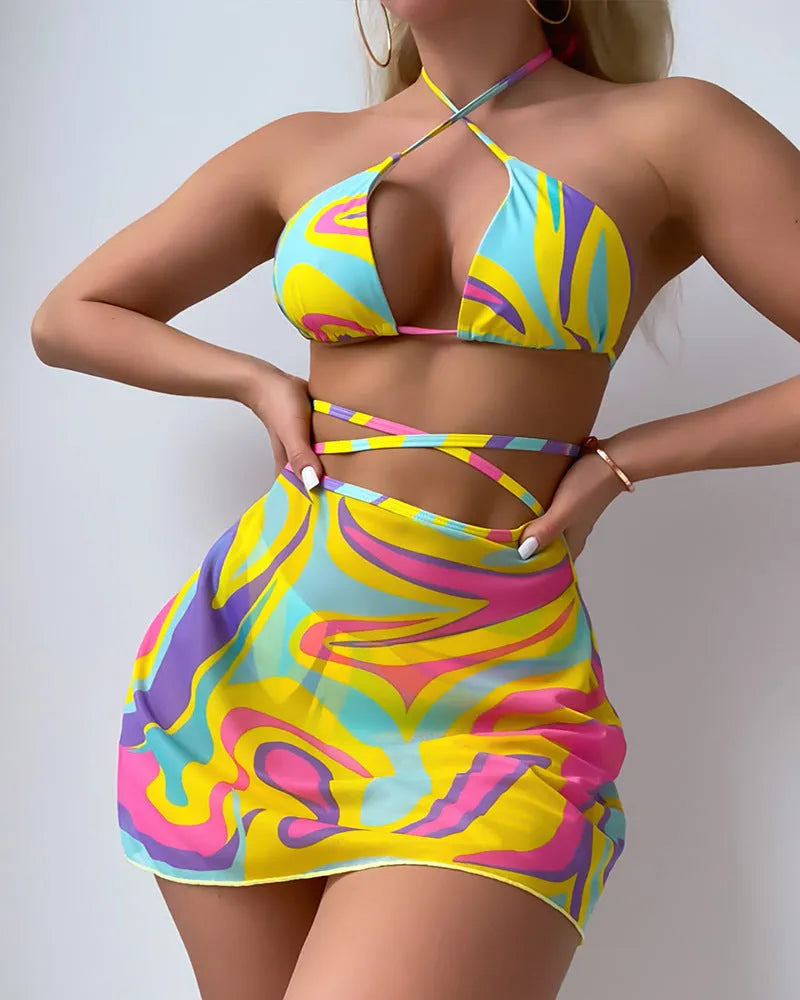 Yellow striped halter neck swimsuit set for women, showing top, skirt, and shorts with lace-up detail.