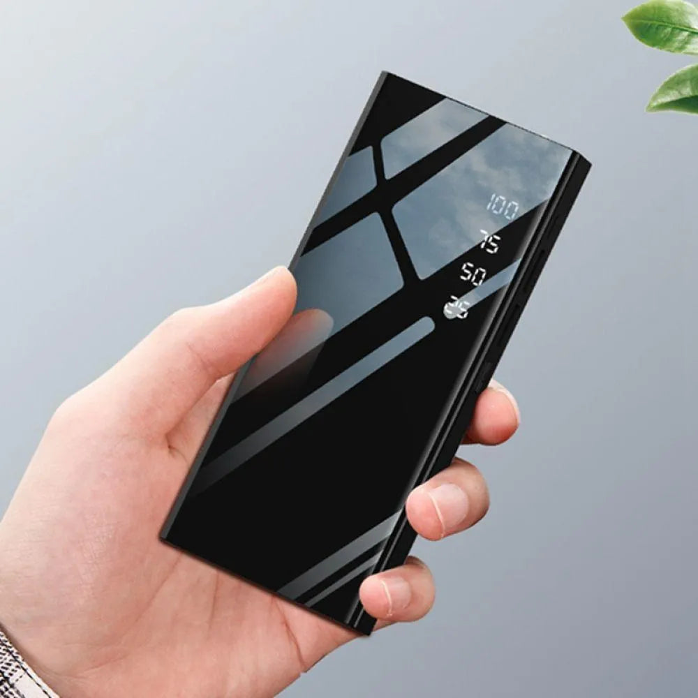Black 20000mAh portable power bank with LCD display showing battery percentage and dual USB ports