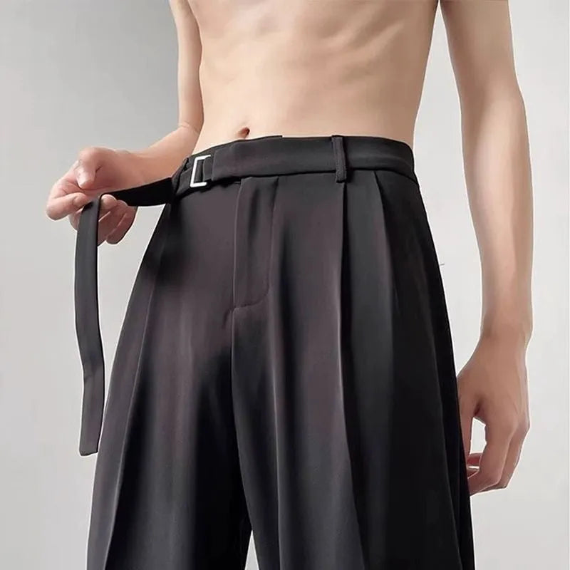 Black straight leg loose fit casual trousers on a hanger, front view.