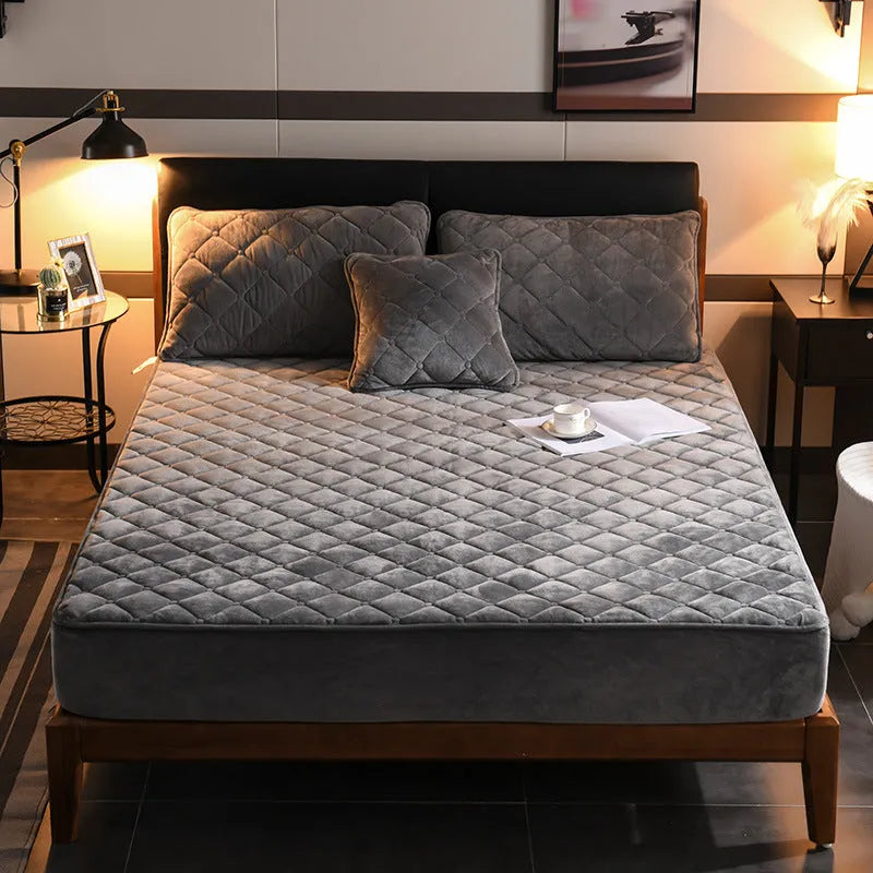 Crystal fleece padded bed cover in grey with quilted stitching and matching pillow case