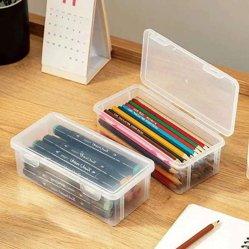 Transparent plastic pencil storage box for organising pens and drawing tools