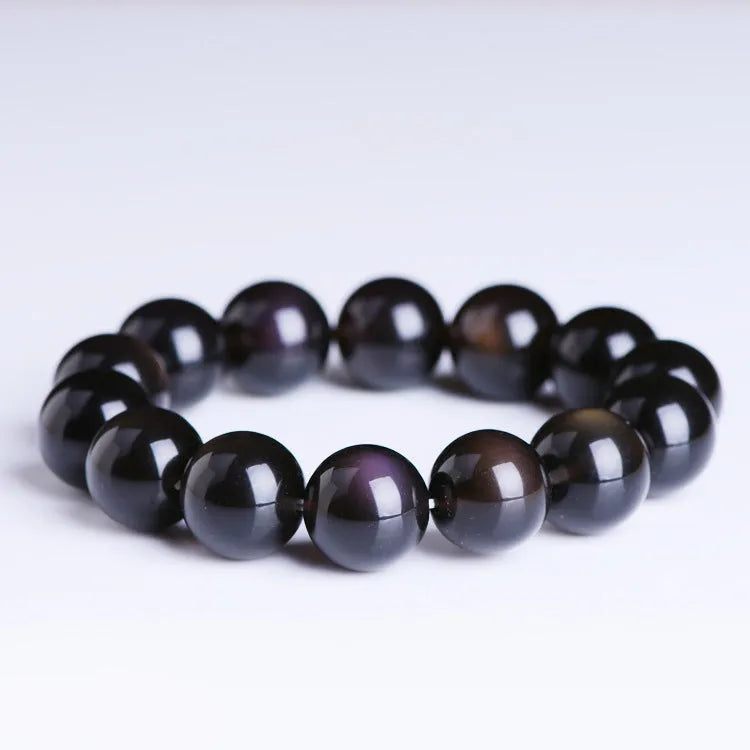 A polished crystal Pi Xiu bracelet with geometric beads on a wrist, shown in Ice Stone and Double Eye Ice Stone variants.