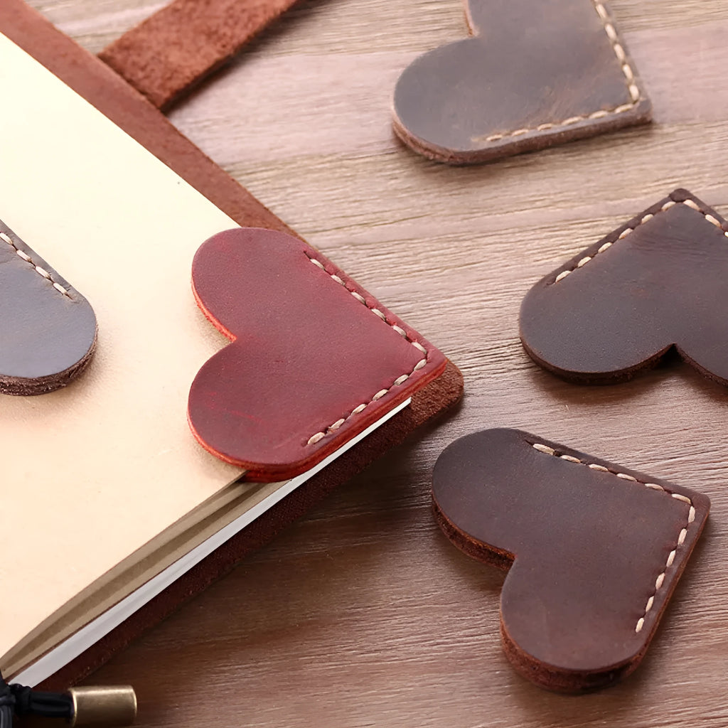 Heart-shaped bookmark in brown crazy horse leather with textured surface and handmade edges